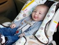 car seat infant laughing